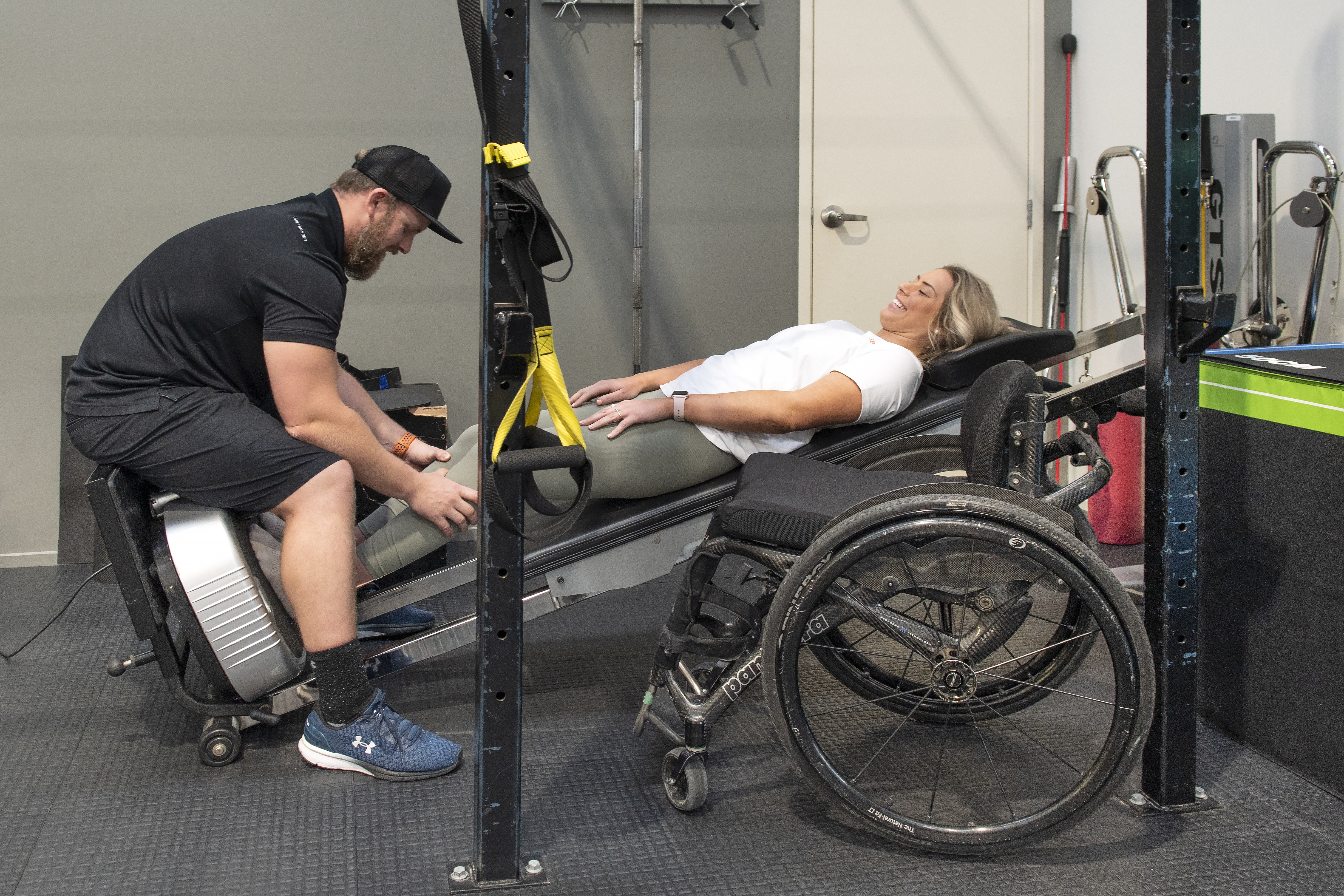 Casey lying down using Power Plate